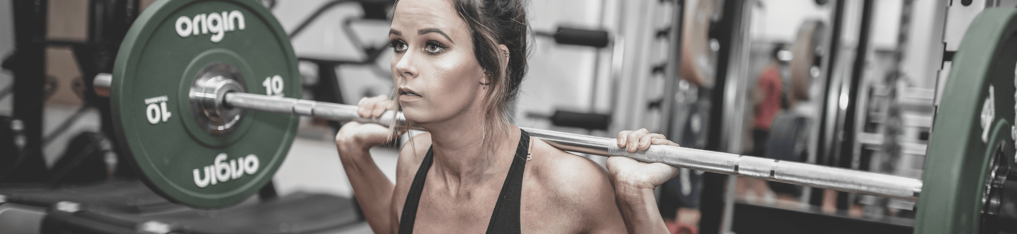 Girl Lifting Weights In Gym