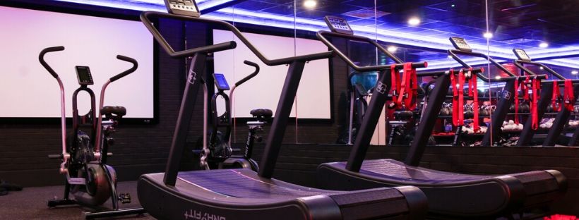 Two treadmills and two assault bikes in the power studio