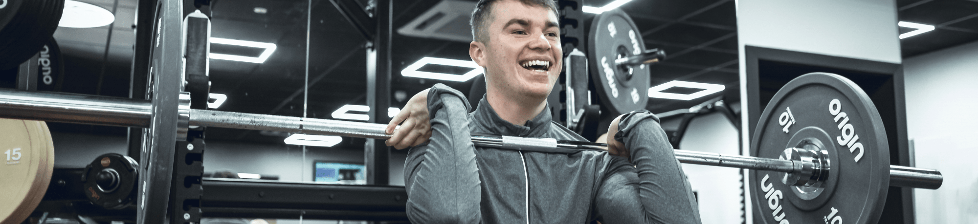 Man Lifting Weights In Gym