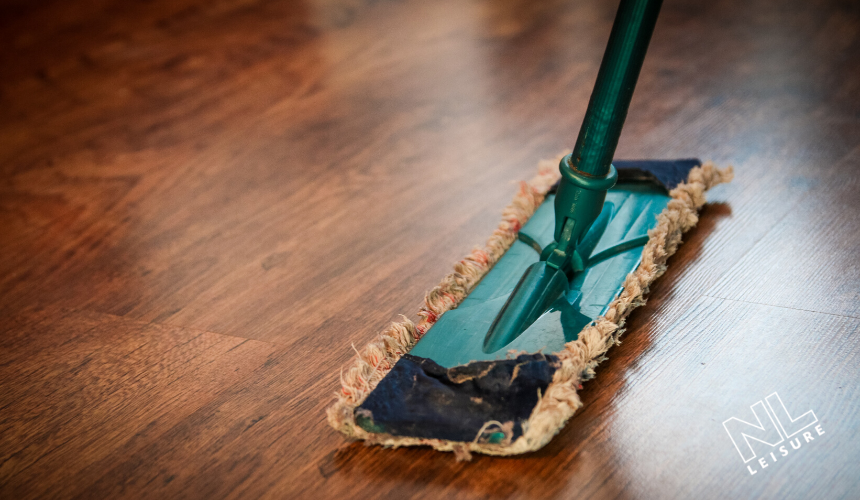 FLOOR BEING WASHED WITH MOP