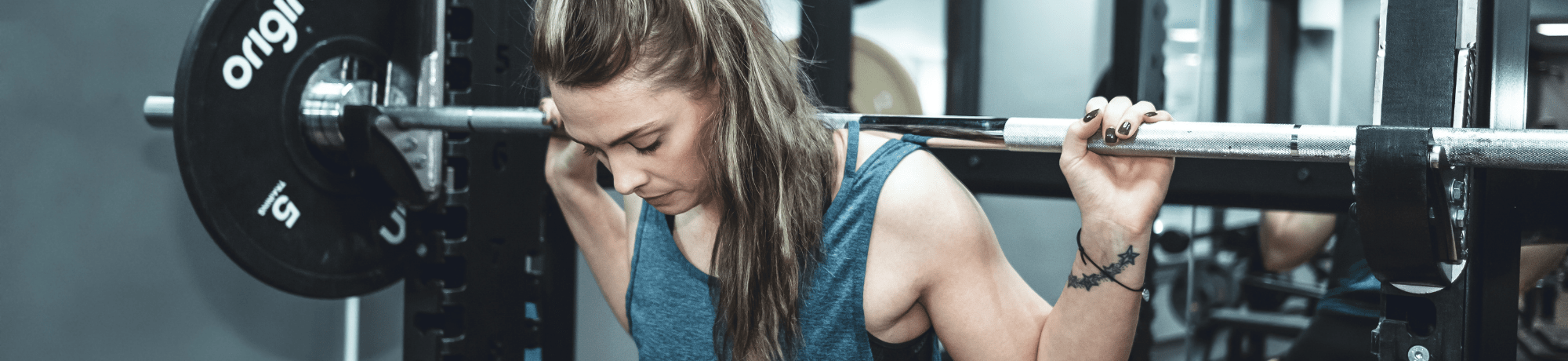 Girl Lifting Weights In Gym