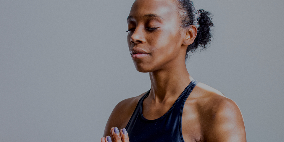 Woman in prayer position hands together 