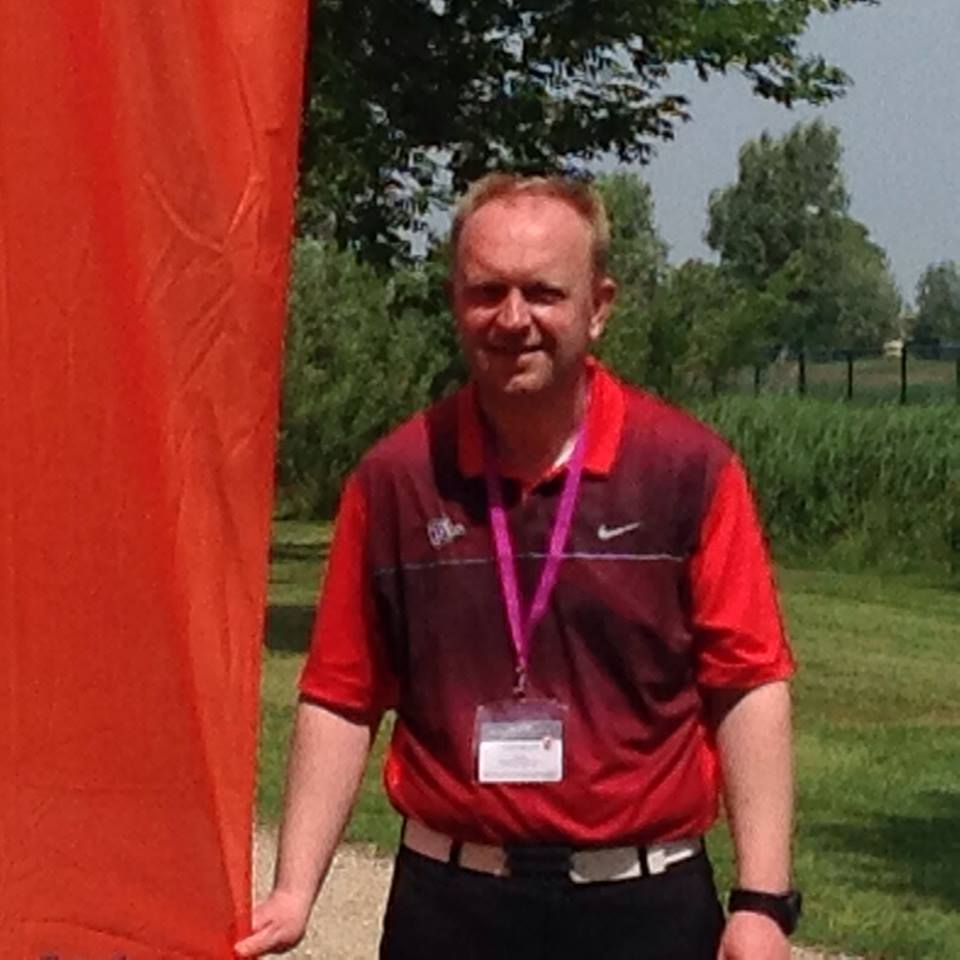 JOHN WHILE PLAYING GOLF