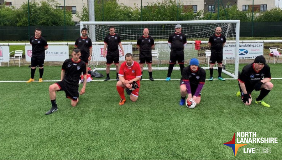 kickstart team kneeling in front of goals